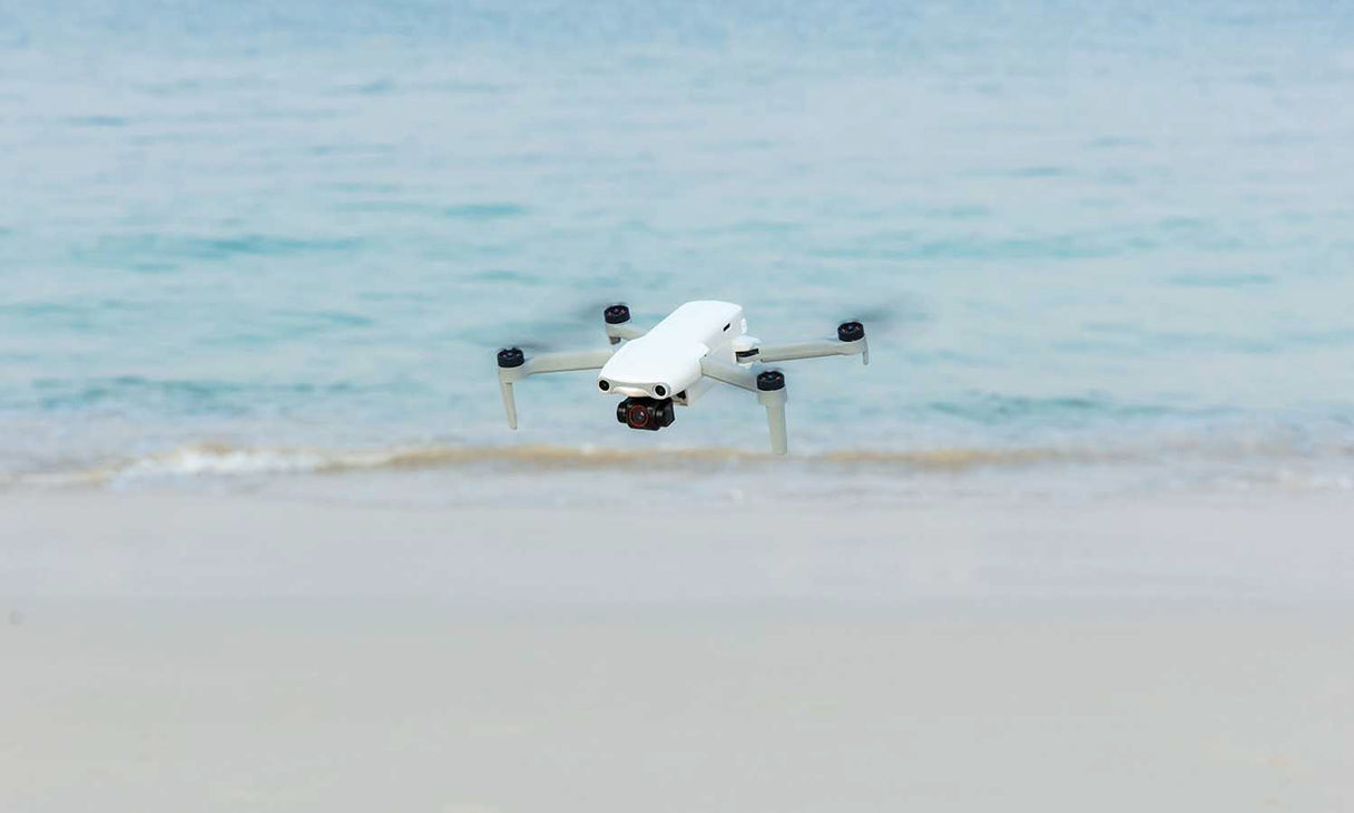 Flying drone on the beach